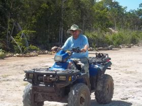 Man riding an ATV in Belize – Best Places In The World To Retire – International Living